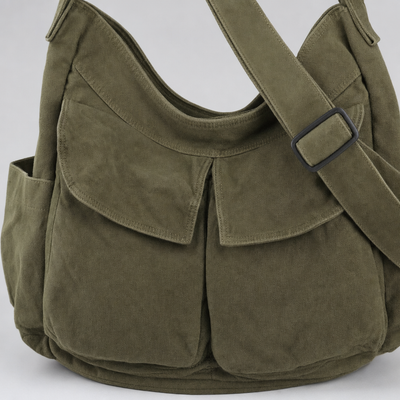 Close-up of the front pockets on the Gadsby Canvas Crossbody