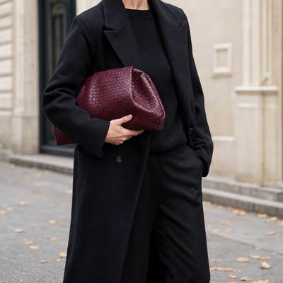 Woman carrying the Everley Pouch Clutch